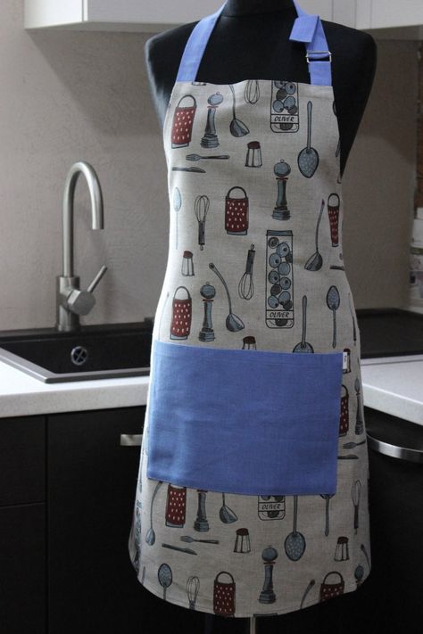 Linen apron is the centerpiece of your kitchen! Put on your new apron and you will never want to change it! This apron is a wonderful gift for anyone. It is very useful at home and at work, not only for cooking but also for housework, gardening and crafting! Full length apron has a front pocket. One size for many people! Apron has an adjustable neck strap and waist straps are long enough.  Apron is hand made of 55% linen, 45% cotton. Size: Length 75 cm (29,5 in) Width 70 cm (27,5 in) WASHING INS Kitchen Apron Design Ideas, Kitchen Apron Design, Christmas Gift Ides, Men Apron, Apron For Men, Apron Design, Fashion Apron, Linen Pinafore, Printed Linen Fabric