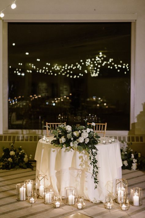 Winter Wedding Ballroom Decor, Winter Gold Wedding Theme, White Roses Winter Wedding, White Winter Wedding Flowers Centerpieces, Sweetheart Table Wedding With Candles, January Wedding Inspiration, Winter Garden Wedding Theme, Romantic Winter Wedding Flowers, Classy Sweetheart Table