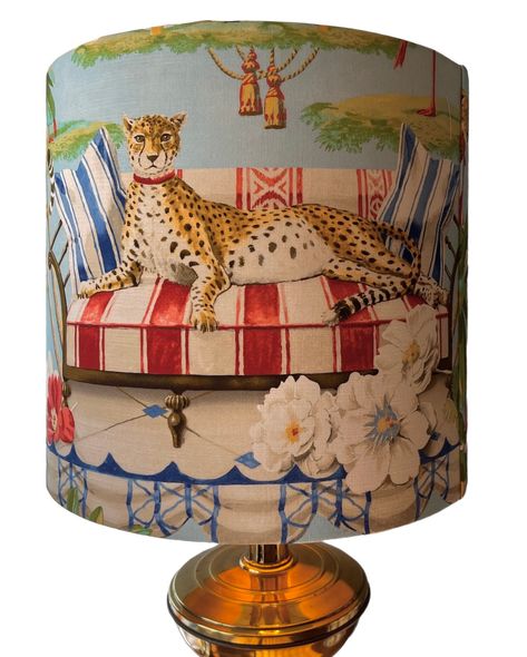 This beautiful lampshade has been covered in a stunning Harrison Howard fabric featuring cheetahs, flamingos and lots of fauna and flora. It is sure to  make a statement in any room.  Handmade in beautiful Greenville, SC. All lampshades have a single seam and rolled edges. Please note that the pattern placement can vary however I try my best to ensure optimal placement each time. The pattern will not always match up at the seam. The shape of the shade is a drum shape which means the top and bott African Airbnb, Parrot Lamp, Decoupage Lampshade, Harrison Howard, Farmhouse Upholstery Fabric, Flamingo Lamp, Mold Art, Unique Lampshades, Pink Lamp Shade