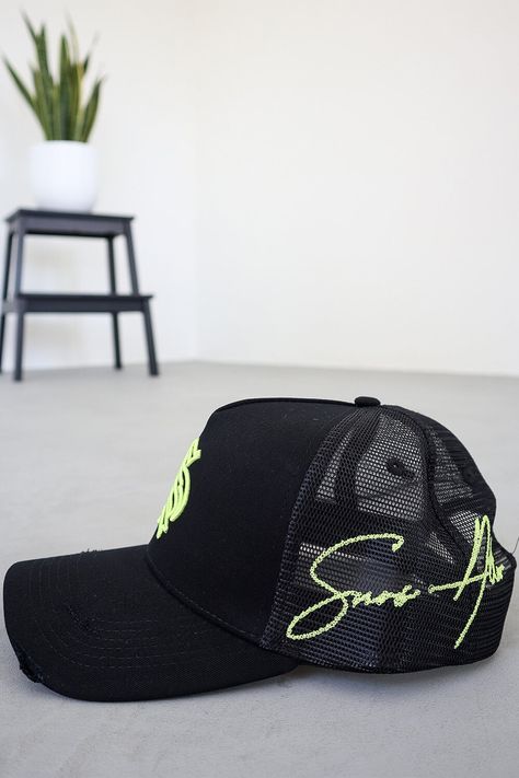 Black/Neon Yellow Distressed Trucker HatThis distressed trucker hat is made from durable, high-quality fabric and features a neon yellow embroidered logo front logo, with an embroidered script logo on the side mesh panel. Its adjustable snapback closure provides a comfortable fit, designed to last through all seasons. Distressed Peak Mesh Back Panels 3D Embroidered Front Outline Logo 2D Script Embroidery on side Adjustable Rear Strap Custom 'S' Rear Tag One Size (58cm) Trucker Hat Custom, Jet Logo Design, Trucker Hat Embroidery, Black Trucker Cap, Trucker Cap Design, Trucker Hat Designs, Cap Design Ideas, Trucker Hat Outfit, Ny Cap