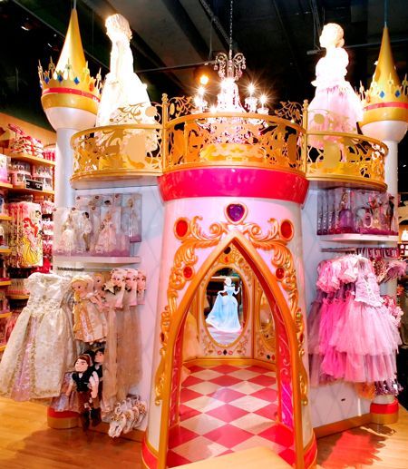 This castle is featured in most newer Disney retail stores, this is usually where princess dresses can be found along with the more feminine kids collections Disney provides. go inside the castle and visit some of your favorite princesses. this makes the shopping visit more of an experience, and a bit more magical. Abbey Obernberger Toy Store Design, Ala Moana Center, Early 2000s Aesthetic, Princess Theme Birthday, Moving To Hawaii, Mall Stores, Store Interiors, Princess Theme, Happy Hours