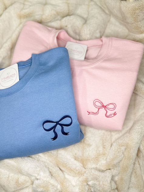 Channel your inner darling with this adorable coquette-inspired sweatshirt, featuring a delicate embroidered bow on the upper left chest. This soft and cozy crewneck is perfect for layering or wearing on its own, adding a touch of sweetness and femininity to any outfit. Available in a variety of colors to suit your style, this sweatshirt is sure to become a staple in your wardrobe. Features: Soft and comfortable unisex fit Embroidered coquette bow detail Choose your thread color This sweatshirt Coquette Crewneck, Sweet Shirts, Cute Crewneck Sweatshirt, Delicate Aesthetic, Bow Sweatshirt, Bows Coquette, Ballet Aesthetic, Embroidered Bow, Preppy Coquette