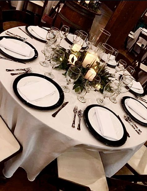 Table Setting With Black Chargers, Black Wedding Chargers, Wedding Black Charger Plates, Black Charger Table Setting, Eucalyptus And Black Table Decor, White Plates Black Silverware Table Setting, Wedding Black Plates, Black Charger White Plate, Black Charger Plates Wedding Table Settings