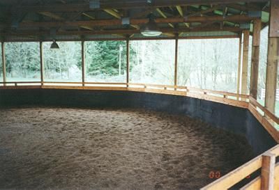 Covered round pen with 3/4" rubber mats on the walls. Outdoor Riding Arena, Round Pens For Horses, Covered Riding Arena, Square Building, Barn Layout, Equestrian Barns, Riding Arena, Barn Stalls, Stable Ideas