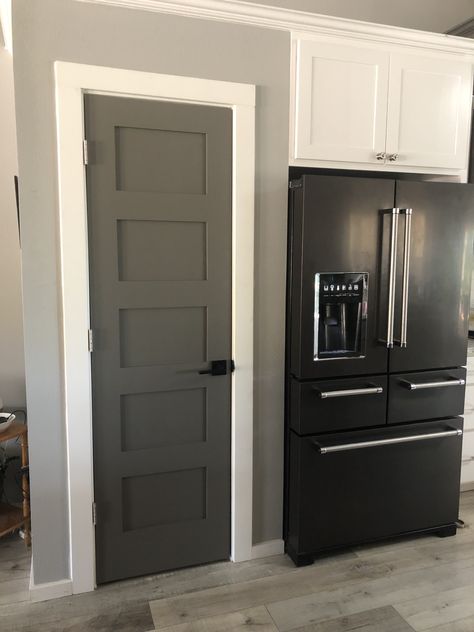 Dark Grey Farmhouse, Dark Gray Interior Doors, Gauntlet Grey, Dark Interior Doors, Grey Walls White Trim, Gray Interior Doors, Kitchenaid Appliances, Interior Door Colors, Grey Interior Doors