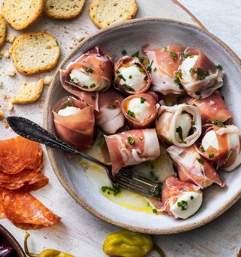 Prosciutto-Wrapped Mozzarella Balls Appetizer | Yankee Magazine Prosciutto Mozzarella Appetizer, Prosciutto Wrapped Mozzarella, Mozzarella And Prosciutto Appetizers, Mozzarella Prosciutto Appetizer Recipes, Prosciutto Wrapped Cheese, Mozzarella Appetizer Ideas, Seasoned Mozzarella Balls, Mozzarella Ball Appetizers, Mozzarella Recipes Appetizers