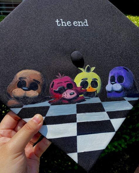 Five Nights at Freddys design 🩷 Only booking grad caps for June 18th and forward! Book through my website only 🩷www.advbellearts.com __________ #advbellecaps #gradszn #classof2024 #gradcapdesign #gradcapideas #fnaf Painted Graduation Cap Ideas, Twice Graduation Cap, Fnaf Grad Cap, Stardew Valley Graduation Cap, Senior Grad Caps, Fnaf Graduation Cap, Cartoon Graduation Cap, Senior Cap Ideas, Funny Grad Cap Ideas