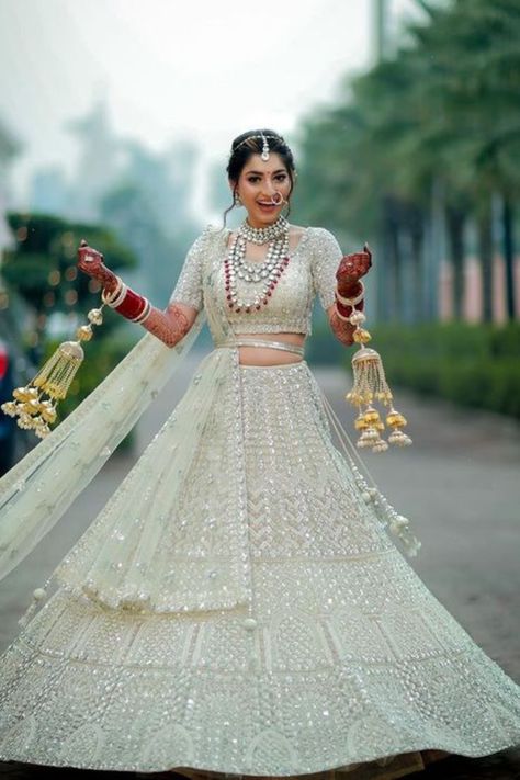 If experimenting with colors is your thing then you can never go wrong with white. Ditch the regular red lehengas this time and experiment with the best summer collection trending huge this season.#weddingbazaar#indianwedding #whitelehenga #whitelehengabridal #whitelehengasimple #whitelehengacholi #whitelehengaoff #whitelehengared #whitelehengadesigns #whitelehengacolorcombos #whitelehengasabaysachi #whitelehengaplain #whitelehengabridalbrides #whitelehengablouse #whitelehengadesignlatest Bridal Lehenga White, White Indian Wedding Dress, White Bridal Lehenga, Wedding Lenghas, Latest Bridal Lehenga Designs, Bridal Lehenga Designs, White Lehenga, Latest Bridal Lehenga, Wedding Lehenga Designs