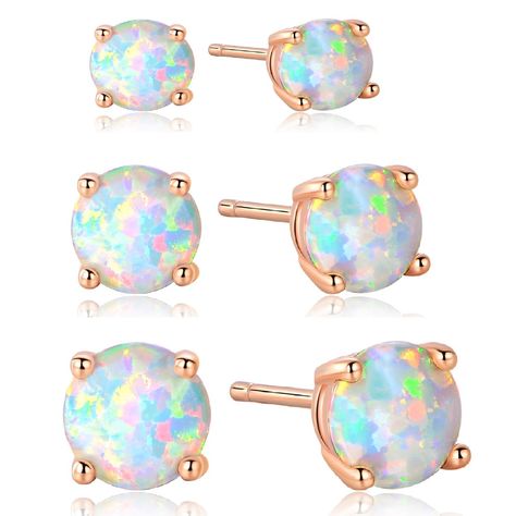 PRICES MAY VARY. This is opal stud earring, the opal stone size is 6mm, the opal is Synthetic Opal which produced in japan.They're not too big and not too small. The opal is very real looking and is colorful. it will be very sparkly and get a lot of compliments when you take it. This earring will come with a jewelry pouch which creat a lovely packaged gift.  * OPAL Color: White   * Plating Color: 18K Rose Gold Plate   * Size: 6mm Round   * Package: Shipped Out With A Pouch Gift  * Lock:Butterfly Opal Stud Earrings, Cartilage Earrings Hoop, Opal Earrings Stud, Opal Studs, Cubic Zirconia Earrings, Round Stud Earrings, Cz Earrings, Zirconia Earrings, Cross Earrings