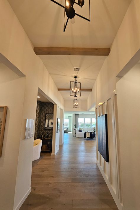 Residential hallway with rustic white oak ceiling beam accents, adding warmth and texture to the ceiling design. Wood Beams On Ceiling Office, Tongue And Groove Ceiling With Beams, Oak Ceiling Beams, Wood Beams On Ceiling, Beams On Ceiling, White Oak Ceiling, Oak Ceiling, Beams Ceiling, Ceiling Office