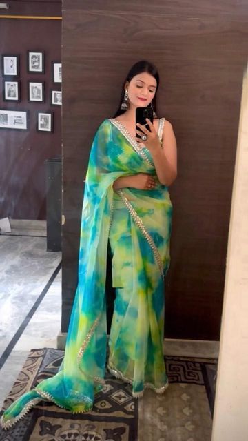 wardrobe luxury by Shreya on Instagram: "Designer green Sky blue organza tie dye saree with mirror work border and embroidered work blouse piece.To buy wtsapp us at 8851109873 or dm . Follow our page for more trending saree reels #saree #sarees #trendingreels #viralvideos #fashionblogger #sareelove #sareesusa" Tie Dye Saree, Saree With Mirror Work, Mirror Work Border, Trending Saree, Farewell Sarees, Blue Organza, Couple Wedding Dress, Saree Poses, Net Saree