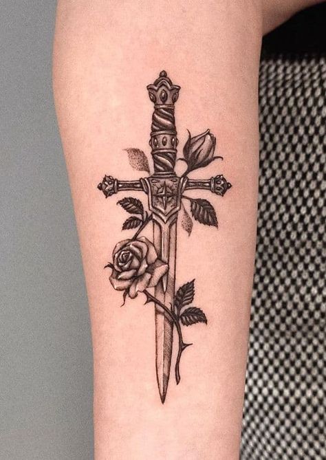 69 Striking Dagger Tattoos With Meaning Knife And Rose Tattoo, Rose And Dagger Tattoo, Snake And Dagger Tattoo, Cross Tattoo On Hand, Rose Tattoo With Name, Rose And Dagger, Rose Tattoo Meaning, Rose Hand Tattoo, Rose Tattoos For Men