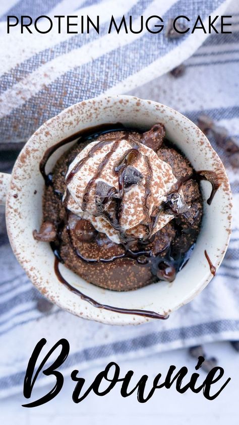 chocolate cake cooked in a coffee mug topped with chocolate syrup, whipped cream, and chocolate chips Protein Powder Cake Mug, Protein Brownie Mug Cake, High Protien Mug Cake, Protein Powder Mug Brownie, Mug Protein Brownie, Mug Protein Cake, Chocolate Protein Powder Mug Cake, Healthy Protein Mug Cake, Microwave Protein Brownie