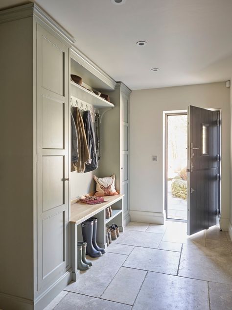 We can’t predict the weekend weather, but we can recommend a boot room. You don’t have to live in a mansion to create a space that keeps muddy wellies, coats and the kids’ shows neat and tidy and the rest of the house clean.⁠ This fabulous boot room features bespoke cabinetry with walnut wood details by #thesecretdrawer, is finished in #blueblood from @paintandpaperlibrary and a reclaimed slate floor. ⁠ ⁠ 📸 | @nickyarsley ⁠ Oak Bench Seat, Boot Room Utility, Natural Stone Floor, Hallway Seating, Utility Room Designs, Mud Room Entry, Large Hallway, Mudroom Decor, Mudroom Laundry Room