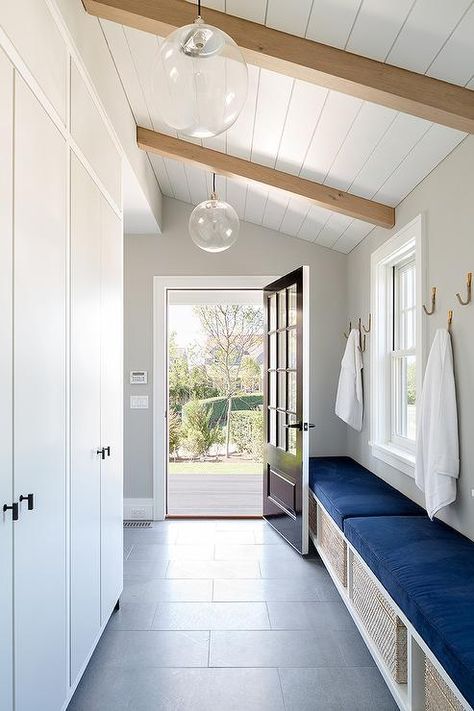 White and blue mudroom Modern Nantucket Home, Modern Farmhouse Mudroom, Modern Beach Home, Farmhouse Mudroom, Nantucket Home, Shiplap Ceiling, Casa Clean, Mudroom Entryway, Slanted Ceiling