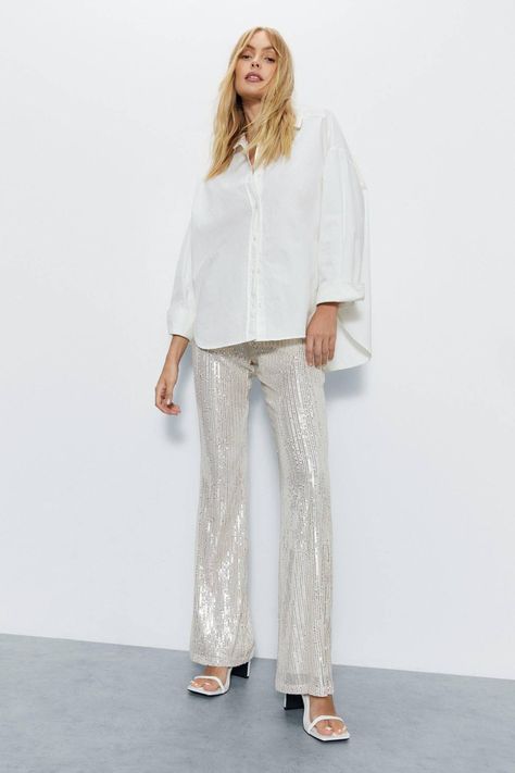 9 Winter Trouser Outfits Anyone Can Copy This Year | Who What Wear UK Sequin Flare Pants, Winter Trousers, Chunky Ankle Boots, Outfits To Copy, Sequin Pants, Trouser Outfits, Party Pants, Leather Shirt, Flare Trousers