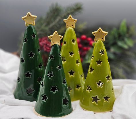 I crafted these luminary trees and carved them by hand.  The star pattern shows up beautifully when lit.  The star on top gives these rustic trees an elegant look and will enhance just about any holiday decor.  I used a high quality, very durable brown speckled stoneward clay and high fire glazes on them for lasting beauty.   The glazes I used are semi-transparent to show off the speckled clay.  (except for the evergreen one) They range from about 5.5 to 6 to 6.5 inches tall.  Choose from the dr Teachers Presents, Holiday Pottery, Wine Cork Christmas Tree, Christmas Pottery, Cork Christmas Trees, Pottery Christmas, Clay Christmas Decorations, Holiday Decor Thanksgiving, Ceramic Christmas Decorations