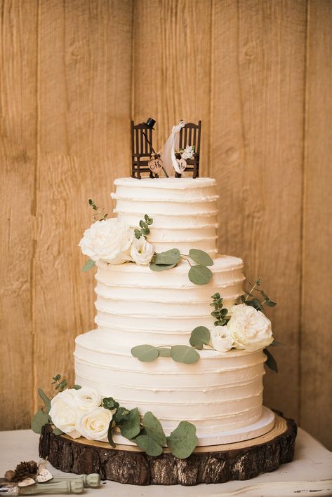 Rustic Three Tier Wedding Cake, Wedding Cake On Wooden Stand, Rocking Chair Cake Topper, Simple Rustic Wedding Cake 3 Tier, Rough Iced Wedding Cake, Rustic Sage Green Wedding Cake, 3 Tier Wedding Cake Rustic, 3 Teir Wedding Cakes, Southern Wedding Cake