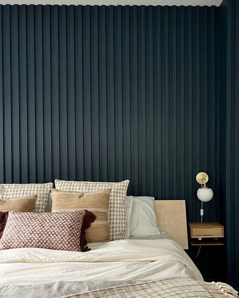 "{We love the depth and texture that this painted wood slated wall brings to the room. The vertical slats make the space looks so much bigger 😱 The clients wanted a color that would pop so we went with Newburyport Blue from @benjaminmoore and we absolutely love it! Check out our insta for the before of this room}" #customwoodwork #paintedwoodslatwall #woodslatedwall #bedroom #bedroomideas #details #accentwallideas Modern Slat Wall Bedroom, Painted Fluted Wall, Painted Wall Slats, Vertical Slat Accent Wall, Painted Wood Slat Wall, Accent Wall Vertical Wood, Navy Slat Wall, Slate Wall Bedroom, Wood Slated Wall