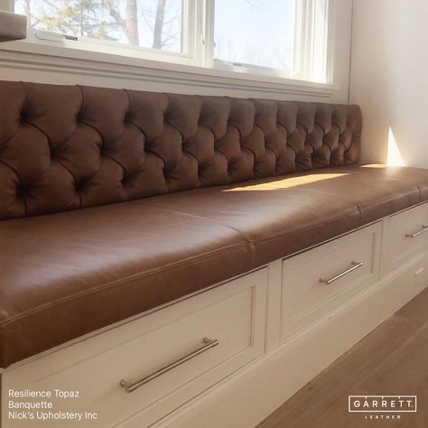 A stunning tufted banquette upholstered in our Resilience Topaz by @nicks_upholstery. Nick ensured the seat cushion was perfectly flush with the adjacent cabinets and that the back didn't extend over the window ledge. With the table and chairs now in place,this space is a perfect breakfast nook for cozy family dinners or entertaining guests. #garrettleather #nicksupholstery #interiordesign #banquette #kitchendining #leatherbanquette #breakfastnook #diningroom #leathercraft #leatherupholstery... Upholstered Dining Banquette, Velvet Breakfast Nook, Diy Booth Seating, Modern Banquette Seating, Banquette Seating With Storage, Basement Seating, Upholstered Banquette Seating, Built In Dining Bench, Diy Banquette Seating