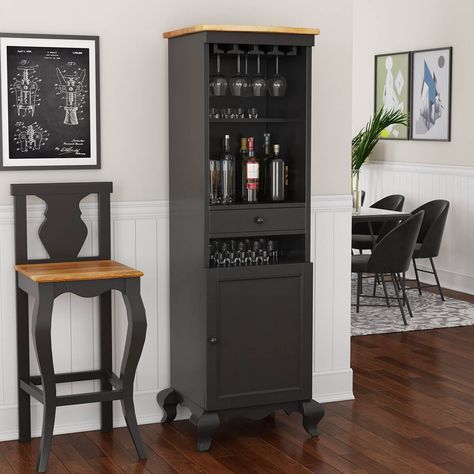 Whether you like mixing your mojitos or are a hard liquor aficionado, our Edinburg Two-Tone Rustic Solid Wood Tall Bar Cabinet will be your partner through every drink. Crafted from Solid Mahogany Wood with a stylistic cabriole-legged base and a teak wood top, this tall bar cabinet can be placed anywhere inside your home – be it in your offices, dens, or casual living areas. Its compact form comes with heirloom-quality craftsmanship that'll last a lifetime, so you’ll definitely be making a long- Narrow Bar Cabinet, Corner Bar Furniture, Rustic Wine Bar, Black Bar Cabinet, Narrow Bar, Tall Bar Cabinet, Bar Cabinet Design, Wooden Bar Cabinet, Corner Bar Cabinet