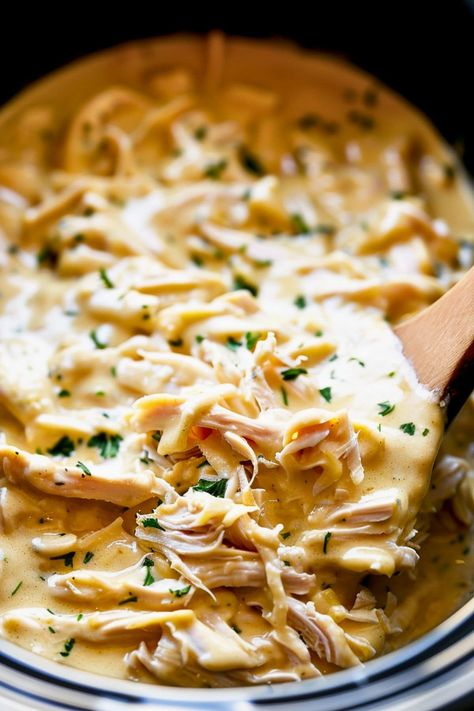 This Crockpot Italian chicken is creamy, easy, and delicious! It's made with a luscious sauce of cream cheese, cream of chicken soup, and Italian dressing. Cream Cheese Italian Chicken Crock Pot, Slow Cooker Creamy Italian Chicken, Crock Pot Chicken Recipes Italian, Chicken Cream Cheese Italian Dressing, Chicken With Zesty Italian Dressing, Recipes With Italian Dressing Packet, Creamed Chicken Crockpot, Olive Garden Italian Chicken Crockpot, Crockpot Creamy Chicken Recipes