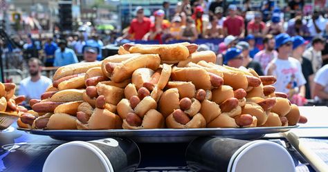 Here's how many calories the Nathan's Hot Dog Eating Contest winner consumed — CBS News Joey Chestnut, Labor Day Holiday, Little Big Town, Beef Hot Dogs, Health World, Contest Winner, Dog Eating, Cbs News, Chris Brown