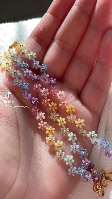 make a rainbow flower bracelet with me 💐💜🥰 in 2022 | Beaded jewelry, Diy bracelet designs, Beaded flowers Flower Bracelet Tattoo, Golden Angel, Make A Rainbow, Bracelet Tattoo, Gelang Manik-manik, Diy Jewelry Unique, Rainbow Flower, Shiny Objects, Tiny Beads