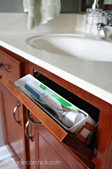 Hidden storage in the bathroom Hidden Toothbrush Storage, Hiding Toothbrushes Bathroom, Toothbrush Storage Hidden, Bathroom Toothbrush Storage, Pedestal Sink Storage, Electric Toothbrush Storage, Recessed Toilet Paper Holder, Kitchen Sink Cabinet, Hidden Shelf