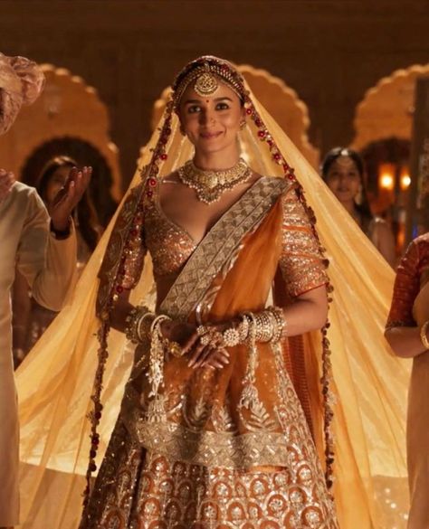 Alia Bhatt's Regal Bridal Look In Rocky Aur Rani Ki Prem Kahaani - Pyaari Weddings Alia Bhatt Rocky Aur Rani, Rani Lehenga, Alia Bhatt Lehenga, Rocky Aur Rani, Alia Bhatt Saree, Orange Lehenga, Latest Bridal Lehenga, Georgette Lehenga, Wedding Lehenga Designs