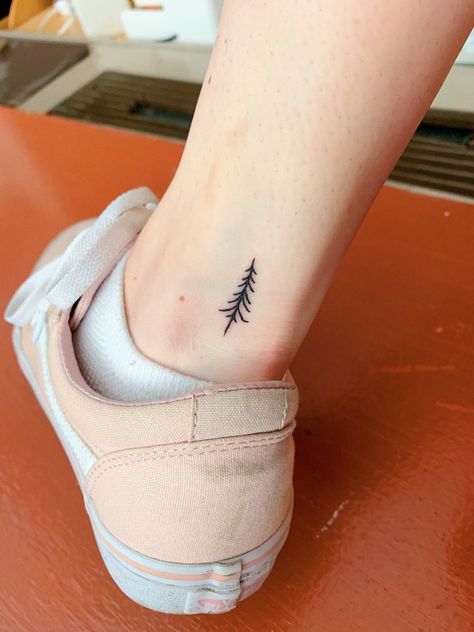 I got this flash tattoo on Friday the 13th for $13! I got it at Village Pop Tattoo in Manhattan, I’m so happy with how it came out. It reminds me of Vermont and skiing in the mountains with my friends and family. #tattoo #minimalisttattoo #treetattoo #fridaythe13thtattoo #tattoos #tinytattoo #smalltattoo Small Pine Tree Tattoo Simple, Tiny Outdoor Tattoos, Small Evergreen Tree Tattoo, Tiny Evergreen Tree Tattoo, Simple Evergreen Tree Tattoo, Fine Line Evergreen Tattoo, Tiny Pine Tree Tattoo, Dainty Tree Tattoo, Vermont Tattoo Ideas