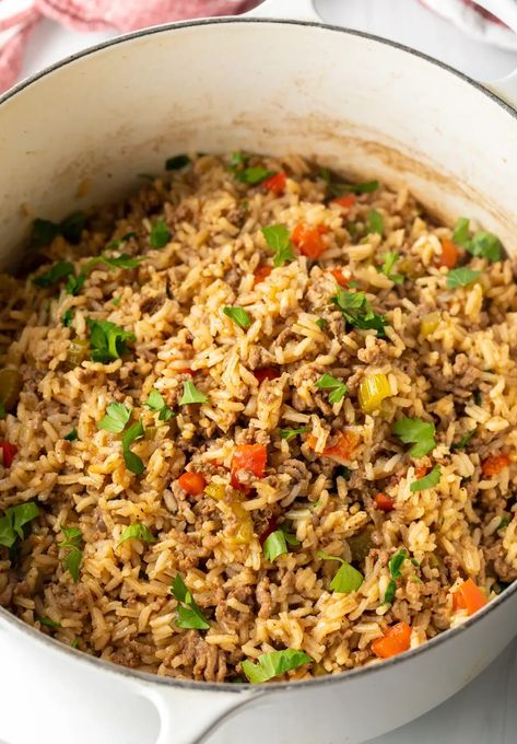 How to Make Dirty Rice - This classic Cajun recipe features ground beef, veggies, and lots of vibrant spices. It's a one-pot dish that's deliciously zesty, comforting, and great to serve as a main or side! Start to finish you need only 40 minutes to make this authentic Creole dinner any night of the week. Ground Beef Dirty Rice, Brazilian Dirty Rice, Pappadeaux Dirty Rice Recipe, Dirty Rice Recipe With Ground Beef, Dirty Rice With Ground Beef, Cajun Dirty Rice Recipe, Cajun Rice Recipe, Grilled Ham Steaks, Cajun Dirty Rice