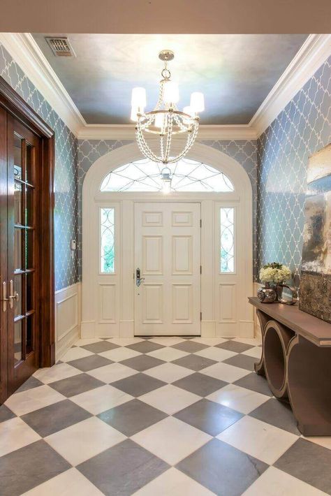 The checkerboard floor of the foyer merges two Ann Sacks tiles: Bardiglio marble and Concord Silver. Metallic silver patterned paper from Anna French adds another shiny texture. Entryway Tile, Transitional Interior Design, Transitional Exterior, Kitchen Ikea, French Interior Design, Ceramic Floor Tile, Door Design Interior, Transitional Living Rooms, Transitional House