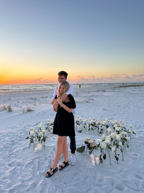 Beach Flower Proposal, Flowers In Sand Proposal, Beach Proposal White Roses, Sunset Beach Proposal Ideas, Dream Proposal Beach, Proposal Ideas White Roses, Sunrise Beach Proposal, Winter Beach Proposal, Intimate Beach Proposal