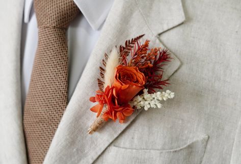 Rust Terracotta Boutonniere,Burnt Orange Rose Boutonniere,Groom Boutonniere,Wedding Accessories,Groomsmen Boutonnière,Wedding Boutonnière  Corsage size 14 x 7 cm. Boutonniere size is 10-13cm. Each floral piece is handcrafted with the same components however each of them arranged slightly different. Whilst all bouquets are packed carefully, some shedding may occur during transit.Thank you for your understanding. About take care: As long as you keep them away from direct sun, store in cool and dry areas they last for years to come. Corsages and boutonnieres for wedding, prom, or any formal occasion. Great as a boho, garden, and country themed weddings too! ------------------------------------------------------------------------------------------------------ We matching bridal bouquet, brides Terracota Boutonniere, Orange Rose Boutonniere, Terracotta Boutonniere, Burnt Orange Boutonniere, Lapel Pins Wedding, Button Holes Wedding, Groomsmen Boutonniere, Rose Boutonniere, Country Theme Wedding