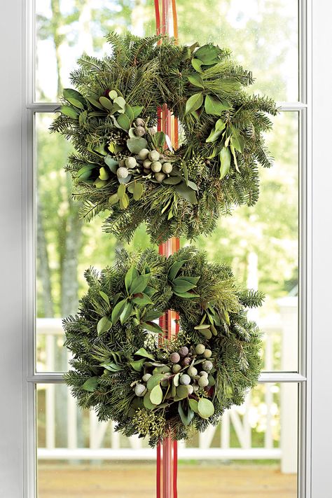 55+ Ways to Decorate with Fresh Christmas Greenery | Instead of hanging one large wreath, try stacking two smaller wreaths on your door. #southernlivinge #christmas #christmasideas Christmas Wreaths For Windows, Fresh Christmas Wreath, Christmas Wreath Ideas, Christmas Prayer, Window Wreath, Holiday Greenery, Small Wreaths, Festive Wreath, Holiday Garlands