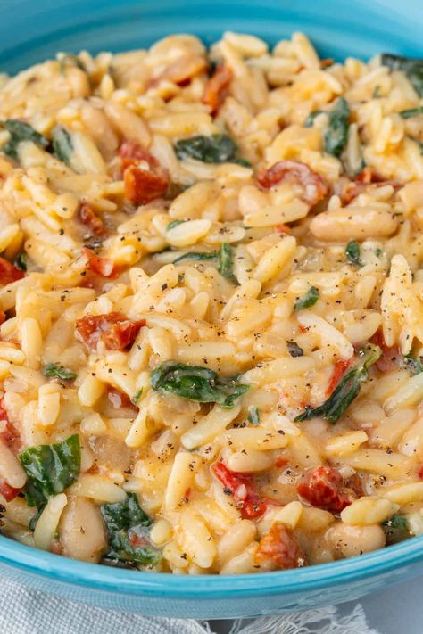 This 30 min creamy Orzo Pasta screams comfort food and uses one-pan. It's healthy, protein packed and lusciously creamy without heavy cream