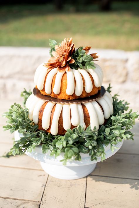 Wedding Cake tip: not a big cake person, Nothing Bundt Cakes and leftover greenery & flowers can do the trick and look amazing! #outdoorwedding #weddingceremony #weddingday #texaswedding #fallwedding #airbnbwedding #covidwedding #smallwedding #dreambackyardwedding #oncloudnunez Everything Bundt Cakes, Bundt Cake Decorations, Greenery Flowers, Cake Centerpieces, Big Cake, Nothing Bundt, Nothing Bundt Cakes, Homemade Wedding, Wedding Cake Table