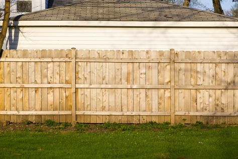 Installing a wood fence increases property value and gives you privacy. Learn how to install a wood fence by yourself the best way—using fence panels. Living Privacy Fences, Fence With Lattice Top, Wood Fence Installation, Dog Ear Fence, Wood Privacy Fence, Cheap Fence, Fencing Material, Fence Styles, Bob Vila