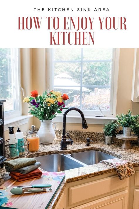 Enjoy your kitchen again with these tips for decorating and organizing your kitchen sink area.    The Scarlet Lily Blog  Fashion, Beauty, Home Decor  #KitchenDecor #KitchenSinkOrganization #KitchenOrganization #HowToOrganizeYourKitchen #KitchenStyle #FarmhouseStyle #KitchenWork #KitchenDecoratingIdeas #KitchenDecorThemes Decor Above Kitchen Sink With No Window, How To Decorate Behind A Corner Kitchen Sink, Corner Sink Kitchen Decor, Corner Kitchen Sink Ideas, Corner Kitchen Sink, Kitchen Sink Decor, Modern Farmhouse Kitchen Decor, Cottage Kitchen Design, Kitchen Sink Organization