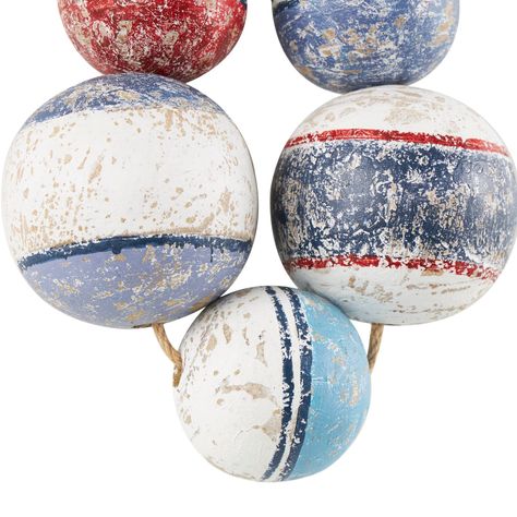 "Buy the Multicolor Handmade Distressed 5 Strung Wooden Buoy Hung Wall Décor at Michaels. com. Made from pine wood, this wall décor piece is a tribute to craftsmanship and durability, ensuring it stands the test of time in your nautical-themed space. The distressed buoy five strung wall décor exhibits a charming blue, white and red color with a weathered finish, evoking a nautical vibe that's perfect for coastal décor. Inspired by blissful serenity and the allure of the sea, where the harmonious Nautical Rope Decor, Buoy Decor, Nautical Home Decorating, Vintage Nautical Decor, Painted Wooden Signs, Nautical Crafts, Rope Decor, Pine Walls, Nautical Wall Decor