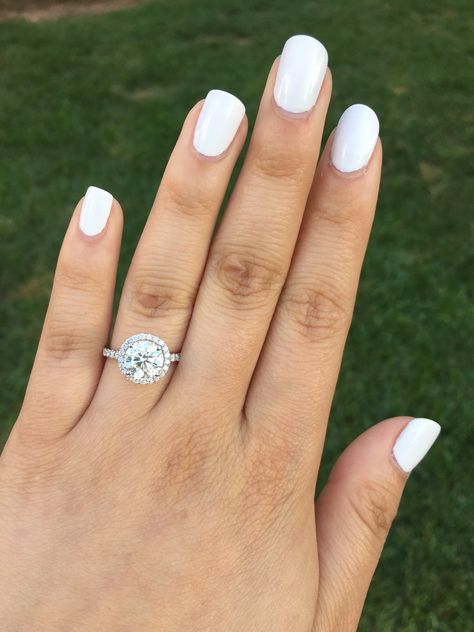 My perfect engagement ring! 2.1 ct round brilliant center stone with halo. Round Ring With Halo, Circle Engagement Rings With Halo, Single Halo Engagement Ring, Circle Engagement Rings, Round Halo Ring, Engagement Ring On Hand, Round Halo Engagement Rings, Future Engagement Rings, Round Halo