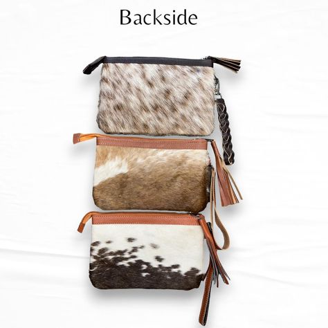 “Level up your style game with our Cowhide Pouch! 🌟 Embrace western-style vibes with this chic wristlet purse, handmade from genuine hair-on cowhide leather. Whether you’re hitting the town or just hanging out, this versatile accessory adds instant flair to any look. Perfect as a gift for her, it’s a surefire way to make a statement! Measuring 8.5 inches wide and 5.5 inches long, it’s perfect for holding your essentials. Plus, with its handy zip closure, adorned with a stylish tassel pull an... Purse Handmade, Wristlet Purse, Western Style, Level Up, Cowhide Leather, Western Fashion, Hanging Out, Your Style, Gift For Her