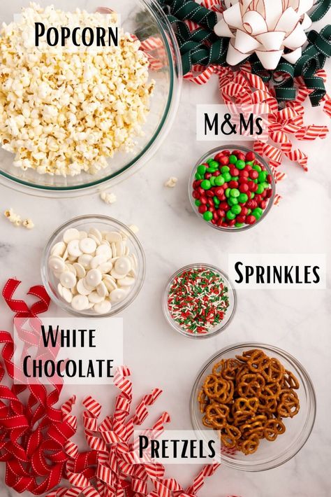 This Christmas popcorn recipe, also knowns as Christmas crunch, is perfect for parties, gifting, movie nights, or as a special snack to celebrate the holiday season! Caramel Popcorn Christmas Gift, Christmas Treats Popcorn, Santa Crunch Popcorn, Christmas Treats Bulk, Movie Night Snacks Christmas, Popcorn Holiday Snack, Christmas Popcorn Snack Mix Recipes, Holiday Popcorn Gift Ideas, Popcorn Neighbor Christmas Gifts