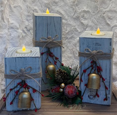 This adorable set of Christmas tea light candle holders will make a great addition to your Christmas decor! These candle holders look great as a centerpiece on the dining table, on the mantel, shelf or just about anywhere you put them!  These candle holders are handmade and distressed so no two sets are exactly alike.  They come already decorated with a gold Christmas Bell, twine and berries. The blocks are approximately 6, 8, and 10 inches high and 3 1/2 inches wide.  PLEASE KEEP IN MIND EACH C Christmas Wood Candle Holders, Wood Block Crafts Christmas, Wooden Block Crafts, 4x4 Candle Holders, Reclaimed Wood Christmas Decor, Scrap Wood Christmas Projects, Diy Jenga Blocks Ideas, 4x4 Crafts, Diy Wooden Candle