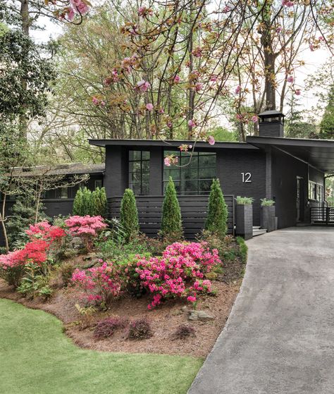 Dark Mid Century Modern Exterior, Unique Exterior House Colors Paint, Mid Century Exterior Lighting, Black Home Exterior, Black Paint Colors, White Painted Floors, Mid Century Modern House Exterior, Brian Patrick Flynn, Guest Bathroom Design