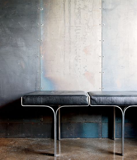 An aluminum bench harmonizes with the industrial nature of the galvanized-steel walls and the polished concrete floor within a metal broker's Collingwood, Ontario, house. Photo by Lorne Bridgman. Metal Facade, Design Industrial, Polished Concrete, Furniture Details, Steel Wall, Interior Furniture, Concrete Floors, Tattoo Studio, Architecture Details