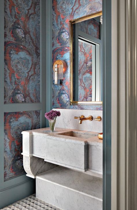 Scalamandré’s Agate in Lava creates a dramatic backdrop for the powder room. Inspired by the look of an antique fountain, the interior designer commissioned a custom marble sink from Material Bespoke Stone + Tile. The vintage Murano-glass sconce is from Sourced by Janet Wiebe. Luxurious Powder Room, Elegant Powder Room, Antique Fountain, Lacquered Walls, Marble Fireplace Surround, Kitchen Redesign, Marble Sinks, Architecture Home, Luxe Interiors