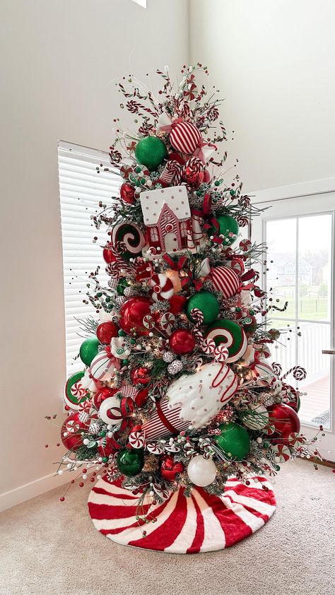 Candyland , in classic colors ♥️💚 39 more sleeps! #kingofchristmas #christmasdecor #candyland #christmastree #christmasinspo | Instagram Red Green And Gold Flocked Christmas Tree, Peppermint Gingerbread Christmas Tree, Nut Cracker Christmas Tree Theme, Candy Cane Christmas Tree Topper, Candyland Christmas Tree Ideas, Colorful Christmas Tree Decorations, Candy Trees Christmas, Decorated Flocked Christmas Trees, Gnome Christmas Tree Ideas