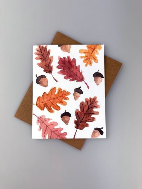 Send a friend or a loved one a special message with this beautifully illustrated autumn leaf greeting card! The warm color palette will be sure to remind you of the cozy warmth of the fall season. Each card comes with a kraft paper envelope made from recycled materials.  SIZE: 4.25" x 5.5". Printed on thick, 120 lb paper with a matte finish. ENVELOPE: Durable, kraft paper eco-friendly envelope derived from recycled materials. DELIVERY: All Items are delivered with USPS, tracking is always provided. Please check out my shop for other great cards! Printing Leaves On Paper, Fall Card Design, Fall Cards Watercolor, Fall Envelope Art, Simple Fall Watercolor Cards, Autumn Leaf Watercolor, Fall Greeting Cards Handmade, Fall Diy Cards, Watercolor Thanksgiving Cards